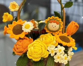 May include: A crocheted basket filled with a variety of crocheted flowers, including sunflowers, daisies, and roses. The basket is made of a woven material and has a brown handle.