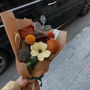 Handmade crochet flower patterns with realistic yarn roses, tulips, and sunflowers, perfect for creating DIY bouquets, home decor, and craft projects.