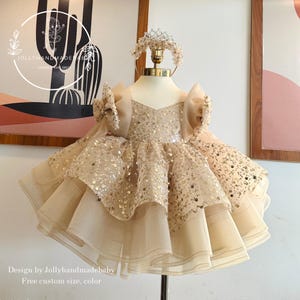 light brown baby dress Vintage Brown Plaid Girls' Bubble Sleeved Dress 2026 Summer New Cute Baby Girl Round Neck Waist