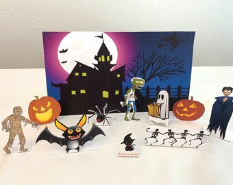 May include: A Halloween scene with a haunted house, a full moon, a zombie, a ghost, a spider, a bat, a pumpkin, a mummy, a vampire, and skeletons. The text "Trick or Treat!" is at the bottom of the image.