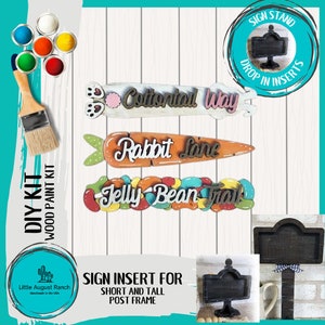 May include: DIY wood sign kit with three different signs: "Cottontail Way", "Rabbit Lane", and "Jelly Bean Trail". The signs are painted in various colors and have a whimsical, spring-themed design. The kit also includes a sign stand and a sign insert for short and tall post frames.