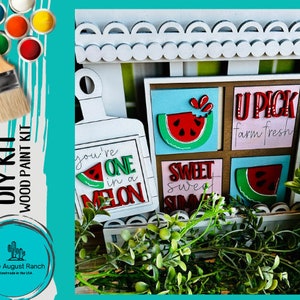 May include: DIY wood paint kit with watermelon themed signs. The signs say "You're one in a melon", "Sweet Sweet Summer", "U Pick Farm Fresh".