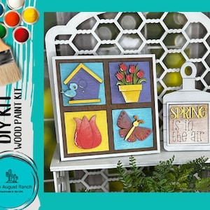 May include: DIY wood paint kit with four squares featuring a birdhouse, tulips, a butterfly, and a flower. The kit also includes a separate sign that reads "SPRING is in the air".