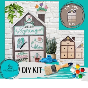 May include: DIY craft kit featuring a wooden house with a "Hello Spring" sign, a butterfly, and flowers. The kit includes paint, a paintbrush, and a 7 piece house set.