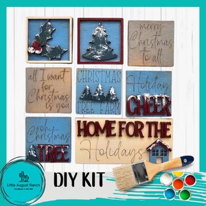 May include: DIY Christmas sign kit with six wooden signs featuring various Christmas-themed sayings and images. The kit includes paint, a paintbrush, and a variety of colors. The signs are ready to be painted and decorated.