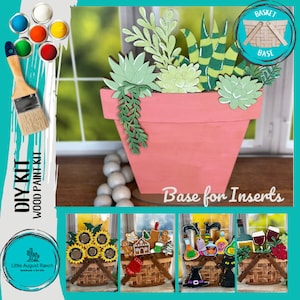 May include: DIY wood paint kit featuring a terracotta flower pot with a succulent plant arrangement. The kit includes a base for inserts, which can be used to create different seasonal displays. The base is shown with three different inserts: sunflowers, gingerbread houses, and Halloween potion bottles.