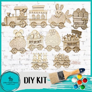 May include: DIY Easter train craft kit with bunny and egg themed wooden cutouts. The kit includes a paintbrush and paints in various colors.