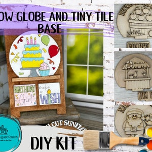 May include: DIY kit for a snow globe and tiny tile base. The kit includes a wooden base with a snow globe, a birthday girl tile, a make a wish tile, and a paint set. The kit is perfect for crafting and decorating.