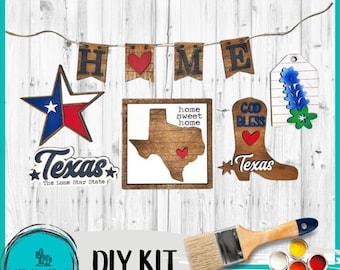 May include: A DIY kit with wooden Texas-themed decorations. Includes a star, state outline, boot, and a banner spelling "HOME". The kit also includes a paintbrush and paint pots. The text "Texas" and "The Lone Star State" are visible.