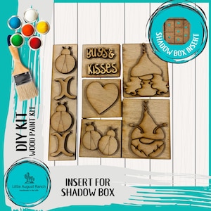 May include: A DIY wood paint kit with various wooden cutouts, including ladybugs, hearts, and gnome-like figures. The kit includes paint pots, a paintbrush, and the text "DIY KIT WOOD PAINT KIT" and "INSERT FOR SHADOW BOX".