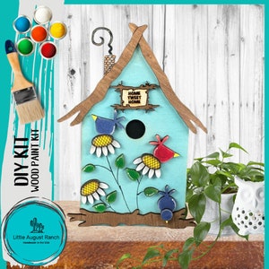 May include: DIY wood birdhouse paint kit with a blue birdhouse, two birds, flowers, and a sign that says "Home Tweet Home".