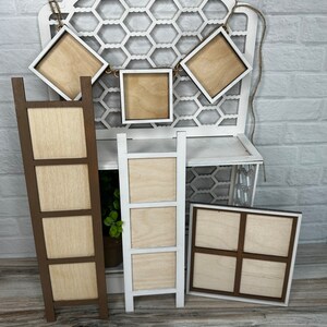 May include: A set of six unfinished wooden picture frames, including a ladder style frame, a four-panel frame, and four individual square frames. The frames are all made of natural wood and have a rustic look.