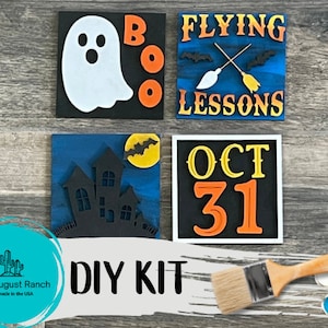 May include: DIY Halloween sign kit with four wooden signs. The signs feature a ghost, the words "BOO", "FLYING LESSONS", and "OCT 31". The kit includes paint and a paintbrush.