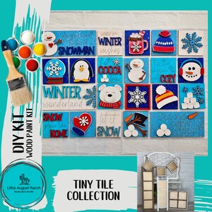 May include: A DIY wood paint kit with 16 winter-themed wooden tiles. The tiles feature various winter designs, including snowmen, snowflakes, penguins, and winter-themed text. The kit includes paint and brushes for painting the tiles.
