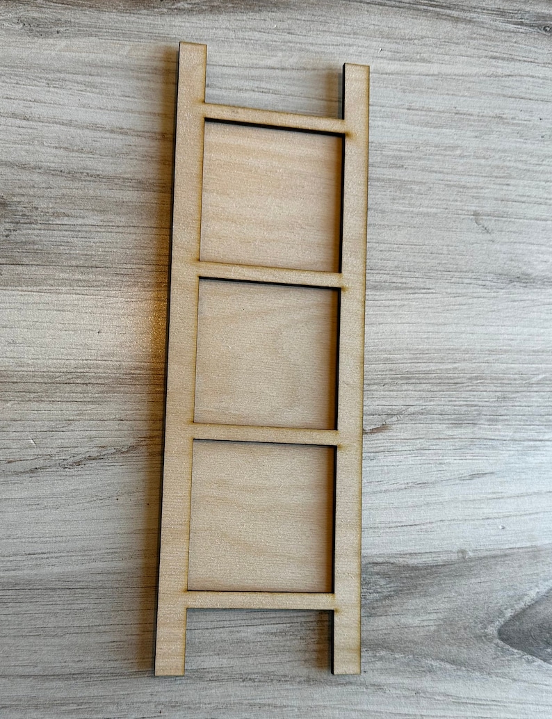 May include: A wooden shelf unit with three rectangular spaces. The shelf unit is made of natural wood and has a rustic look.