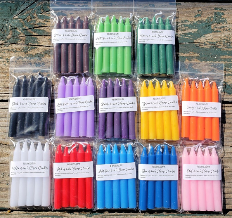 May include: Twelve clear plastic bags, each containing four 4-inch chime candles in distinct solid colors including brown, light green, green, black, light purple, purple, yellow, orange, white, red, light blue, blue, and pink with labels.