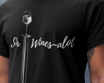 May include: Black t-shirt with a white graphic of a wine glass on a sword and the text "Sir Wines-alot".