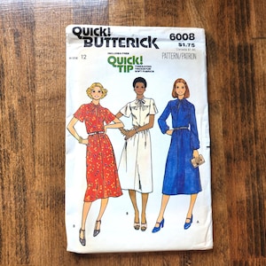 May include: Vintage Butterick sewing pattern 6008, size 12, with illustrations of three dresses. The pattern includes a Quick Tip for soft fabrics. The cover has the text "Quick! Butterick" and the price.