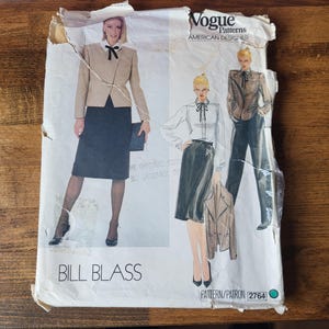 May include: Vogue Patterns American Designer Bill Blass sewing pattern, featuring two women in skirts and blouses. The pattern number is 2764.