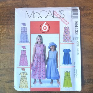 May include: McCall's sewing pattern M4432 for girls' dresses and hats. The pattern features six different looks, including dresses with various sleeve lengths, pocket styles, and hat designs. The pattern size is CCE (3-4-5-6).