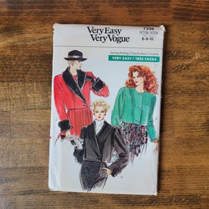 May include: A sewing pattern for three different jackets. The pattern is called "Very Easy Very Vogue" and has the number 7336. The pattern is for sizes 6-8-10. The jackets are shown on three different models. The first jacket is red with a black fur collar and cuffs. The second jacket is green and the third jacket is black.