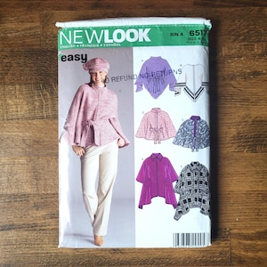 May include: A sewing pattern for making a cape or poncho. The pattern includes instructions for five different styles, including a pink and white cape, a purple cape, and a black and white cape. The pattern is labeled "New Look Easy" and has the number 6517.