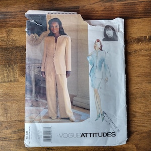 May include: A sewing pattern for a suit with a jacket and trousers. The pattern is for Vogue Attitudes and has the number 1543. The pattern shows two models wearing the suit in different colours.