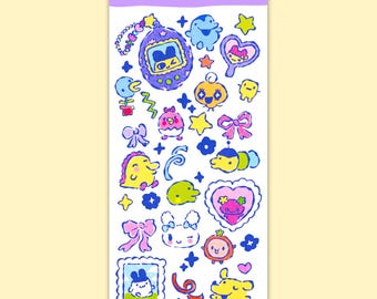 May include: A sticker sheet with various colorful Tamagotchi character designs. The sheet features a purple header with the text "Tamagotchi sticker sheet". The stickers include stars, hearts, bows, and several Tamagotchi characters in a cartoon style.