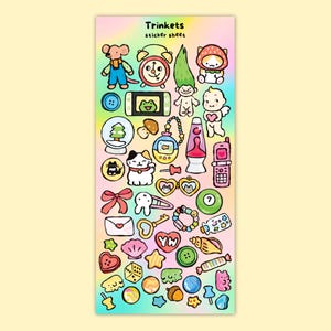 May include: A sticker sheet with various colorful, cartoon-style trinket designs. The sheet includes images of a mouse, alarm clock, troll doll, cat, lava lamp, and a flip phone. The text "Trinkets sticker sheet" is at the top.