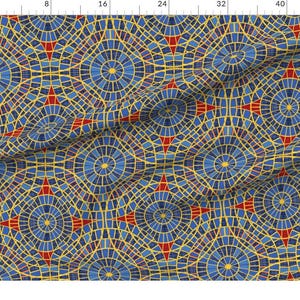 May include: A fabric featuring a repeating geometric pattern of blue circular motifs with yellow centers, interconnected by red four-pointed star shapes and yellow lines. The design resembles a stained glass window or mosaic tile layout.