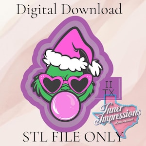 May include: A digital download image featuring a green character with a pink Santa hat and heart-shaped sunglasses blowing a pink bubble. The image includes the text "Digital Download" and "STL FILE ONLY". The character is surrounded by a purple outline.