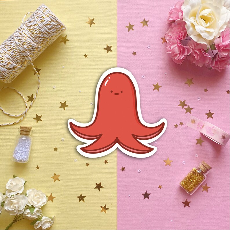 May include: A red cartoon octopus with a simple face on a pink and yellow background with gold stars.