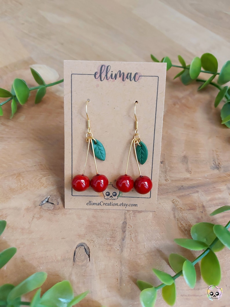 Handmade cherry and small green leaf dangling earrings in polymer clay image 1