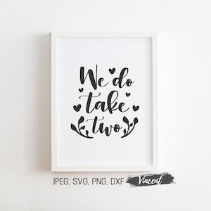 May include: A white framed print with black calligraphy that reads "We do take two" with small hearts and floral accents.