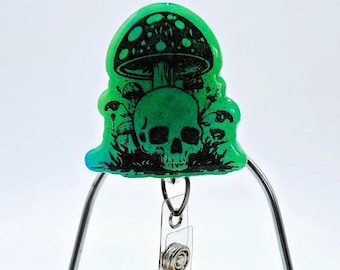 Impugnatura per telefono con fungo e teschio fosforescente; porta badge retrattile fosforescente verde gotico
