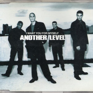 May include: A black and white photo of four men in black clothing standing on a rooftop. The text "I WANT YOU FOR MYSELF" and "ANOTHER LEVEL" is printed on the image.