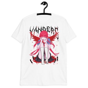 May include: White t-shirt with a graphic print of an anime character with red hair and wings. The character is sitting down with a bloody knife in front of them. The text "Yandere" is printed in black above the character.