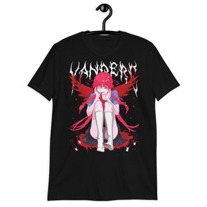 May include: Black t-shirt with a graphic print of an anime character with red hair and wings. The character is sitting on a pool of blood with knives around her. The text "VANDERO" is printed in a metal font above the character.