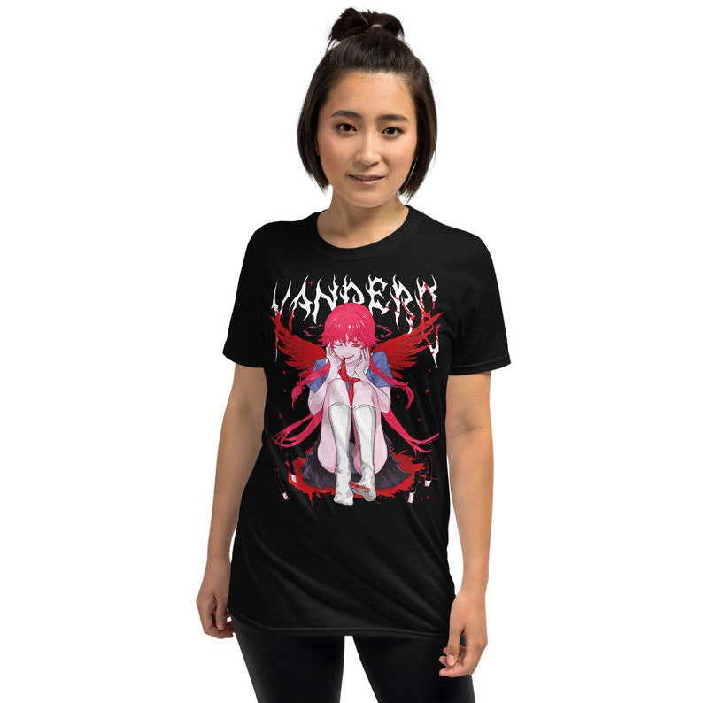 May include: Black t-shirt with a graphic print of an anime character with red hair and wings. The text "VANDERO" is printed in white above the character.