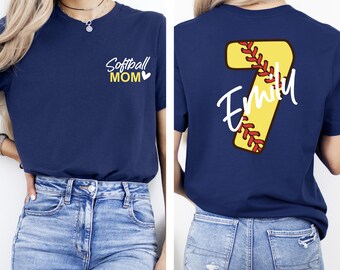 May include: Navy blue t-shirt with the text "Softball MOM" on the front and a softball-themed number 7 with the name "Emily" on the back. The shirt is a short-sleeved design.