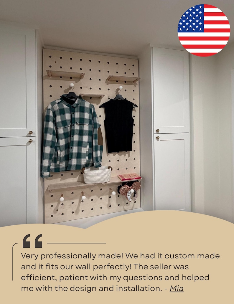 May include: A light-colored wooden pegboard wall organizer featuring multiple circular holes, adjustable shelves, and round pegs. The board displays a green and white plaid shirt, a black sleeveless top, a white woven basket, and a pair of ears.