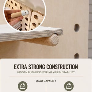 May include: A light-colored wooden pegboard system featuring a shelf supported by a wooden peg. The text reads: EXTRA STRONG CONSTRUCTION, HIDDEN BUSHINGS FOR MAXIMUM STABILITY, LOAD CAPACITY, UP TO 10 kg (22 lbs) PER PEG, 20 kg (44 lbs) PER SHELF.