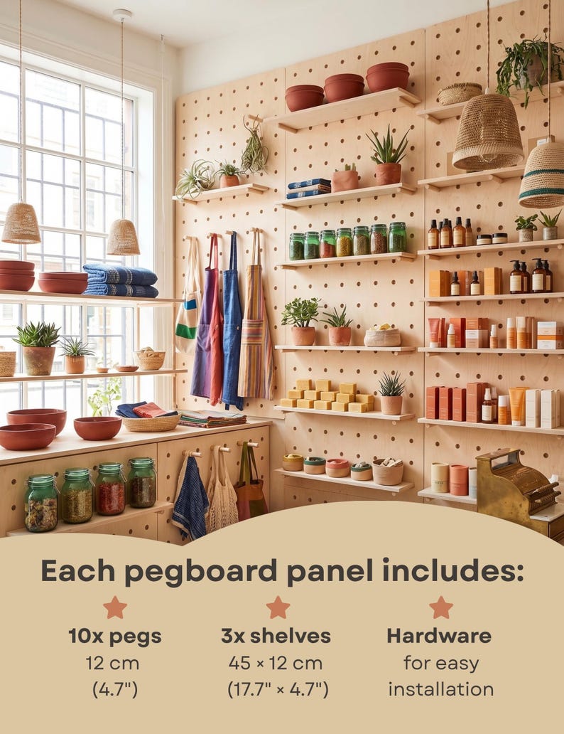 May include: A light-colored wooden pegboard wall system featuring multiple shelves holding various items like jars, plants, and textiles. Text states each panel includes 10 pegs at 4.7 inches, 3 shelves at 17.7 by 4.7 inches, and hardware for easy installation.