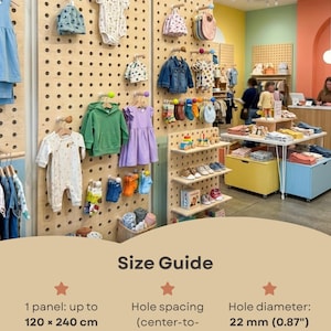 May include: A light-colored wooden pegboard display panel featuring a grid of holes. The size guide text indicates one panel measures up to 120 x 240 inches, with a hole spacing of 3.9 inches and a hole diameter of 0.87 inches for this display system.