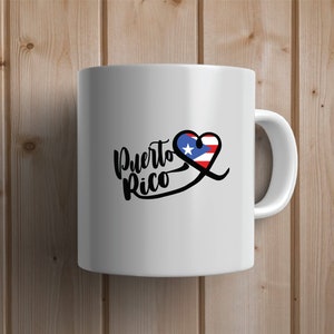 May include: White ceramic mug with a black and white graphic of the words "Puerto Rico" with a heart shape containing the Puerto Rican flag.