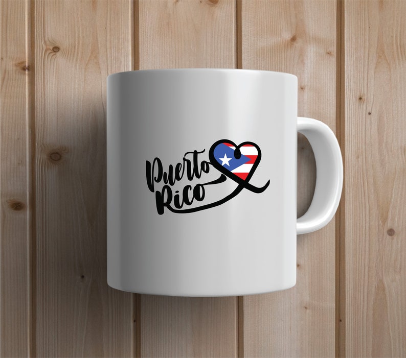 May include: White ceramic mug with a black and white graphic of the words "Puerto Rico" with a heart shape containing the Puerto Rican flag.