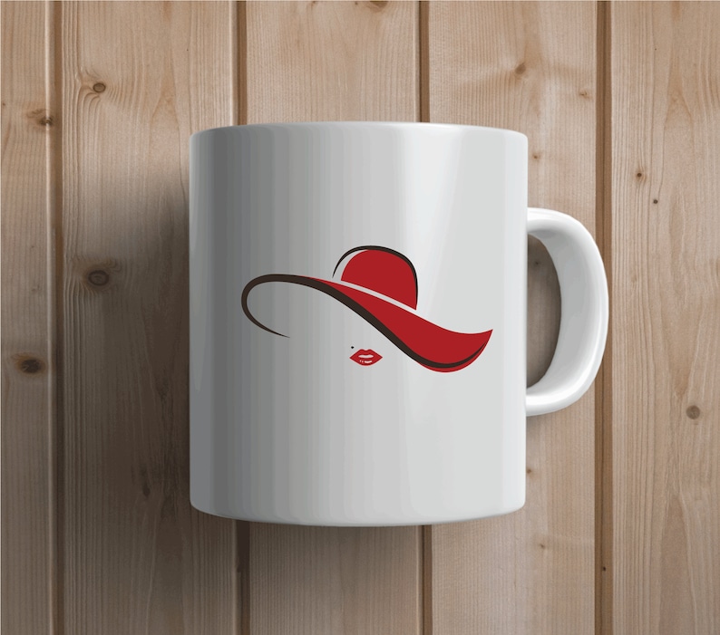 May include: White ceramic mug with a red and brown silhouette of a woman wearing a large hat. The hat is red and the woman's lips are red.