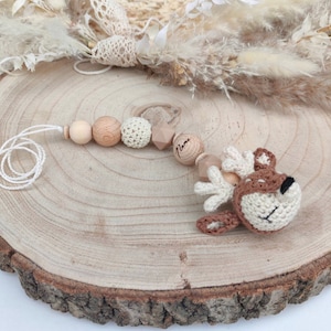 Babyschalenanhänger oder Maxicosikette , gefertigt auf zwei Seilen zum anbringen. Mit süßem Häkeltier .
Perlen aus Buchenholz, Wolle aus Baumwolle. Perlen aus Lebensmittelsilikon.