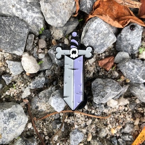 Skull Sword Enamel Pin