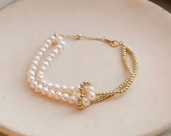 Zoetwaterparel en 18 kt massief gouden dubbelstrengs kralenarmband